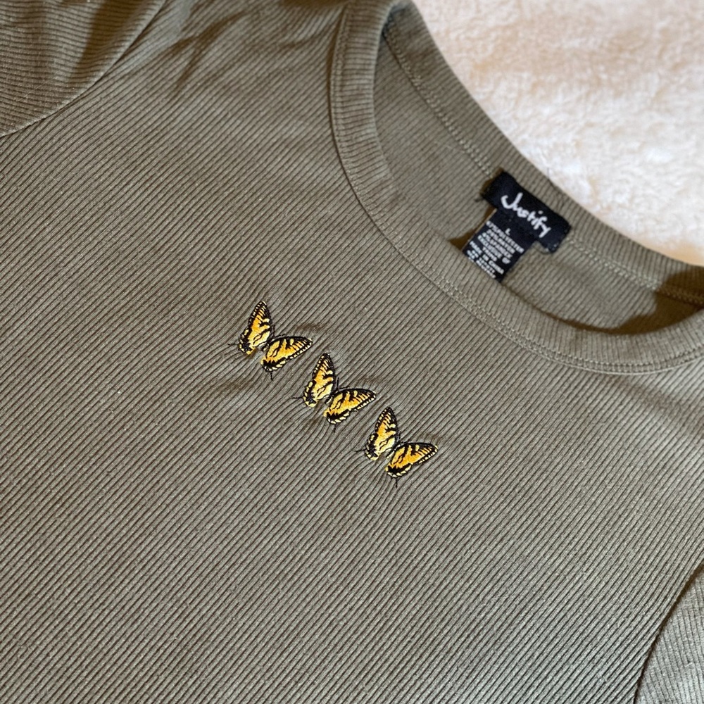 Hunter green top with butterflies size large (junior)
